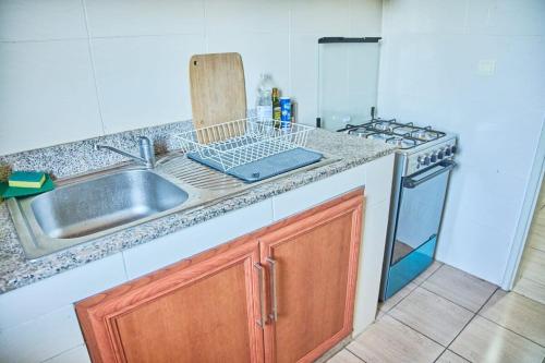 Köök või kööginurk majutusasutuses Le 4ème Ciel Appart Cosy et Équipé Wifi 2TV