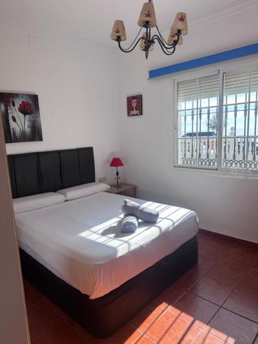 Ένα ή περισσότερα κρεβάτια σε δωμάτιο στο Villa Natalia frente al mar,