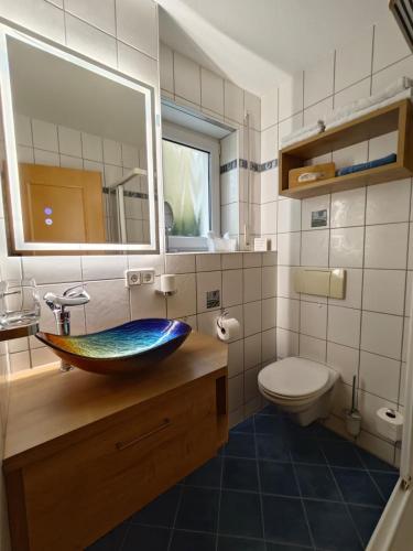 a bathroom with a sink and a toilet at Apartment Apart Waldershof in Waldershof