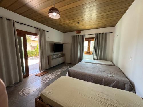 En eller flere senge i et værelse på Vivi Beach Macapá