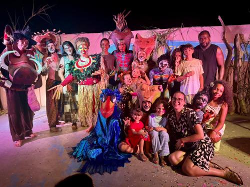 a group of people dressed up in costumes on a stage at Camping Parc Bellevue in Cannes