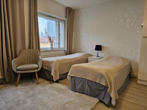 Ένα ή περισσότερα κρεβάτια σε δωμάτιο στο Humppilantie