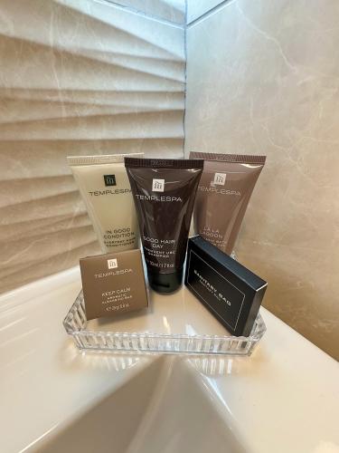 a pile of products sitting on a shelf at Westwood Boutique Aparthotel by Birch Stays in Glossop