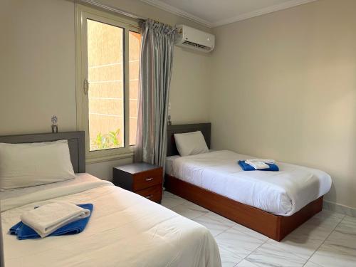 Ένα ή περισσότερα κρεβάτια σε δωμάτιο στο Nozha Beach - Ras Sudr