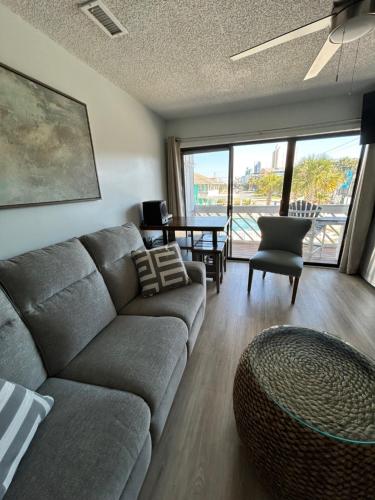 a living room with a couch and a table at Relax at the Beach in Myrtle Beach