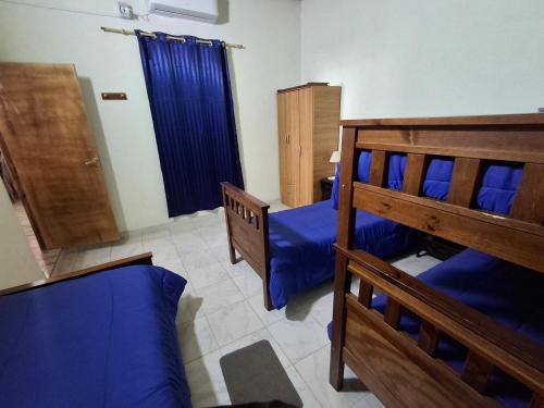 En eller flere senge i et værelse på Cabaña DOÑA LILIA