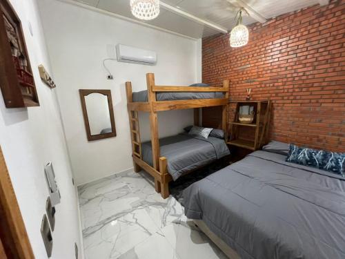 A bed or beds in a room at Casa Quinta Jurumi de La Mala Junta