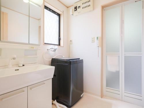 Koupelna v ubytování 世田谷ファミリーハウス