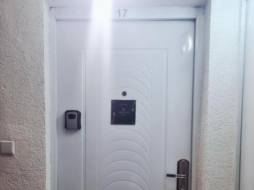 a white door with a sign on it at CARPE DIEM Unique S&P in Valjevo