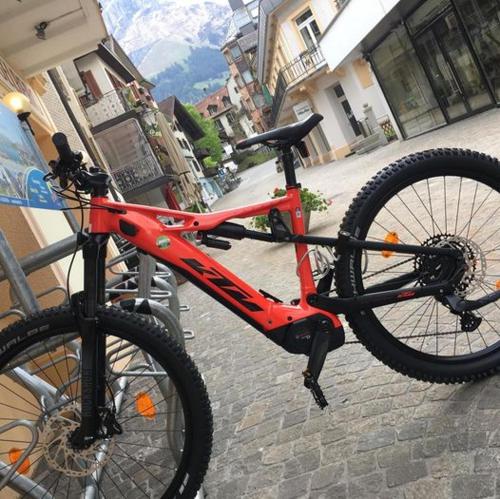 a bike is parked on a brick street at Hostel Engelberg "mein Trail Hostel" in Engelberg