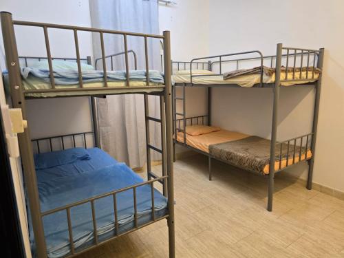 Voodi või voodid majutusasutuse Mozna Hostel toas