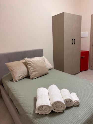 En eller flere senge i et værelse på Near Naples Caserta Center