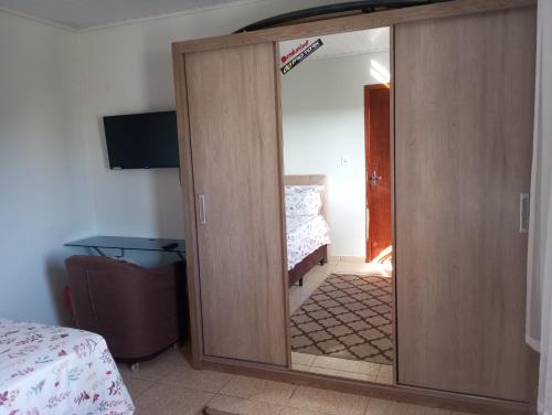 Ένα ή περισσότερα κρεβάτια σε δωμάτιο στο Cantinho de paz