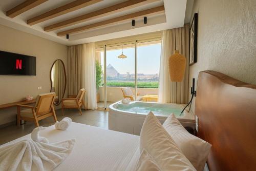 Ένα ή περισσότερα κρεβάτια σε δωμάτιο στο ONE GATE Pyramids View INN