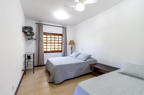 En eller flere senge i et værelse på Edicula aconchegante privativa em Sousas, Campinas