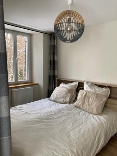 Ένα ή περισσότερα κρεβάτια σε δωμάτιο στο Le Goulet