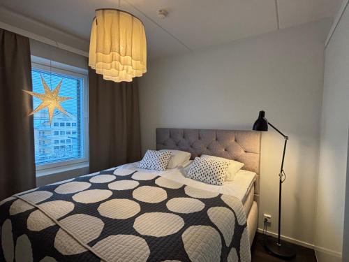 En eller flere senge i et værelse på North Saga Luxury Apartment