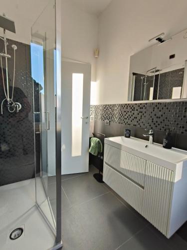 a bathroom with a sink and a shower at Casa Campanella in Spoleto