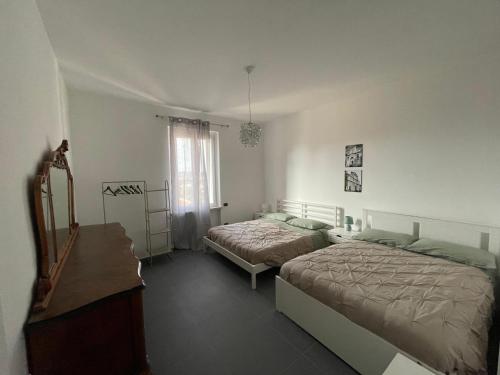 En eller flere senge i et værelse på Casa Campanella