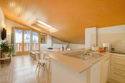 a kitchen with a sink and a counter at Andorra Family Snow Apartment - Happy Rentals in El Tarter
