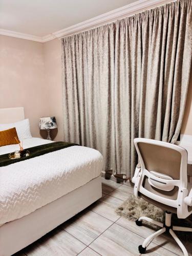 Postel nebo postele na pokoji v ubytování Sunset Heaven