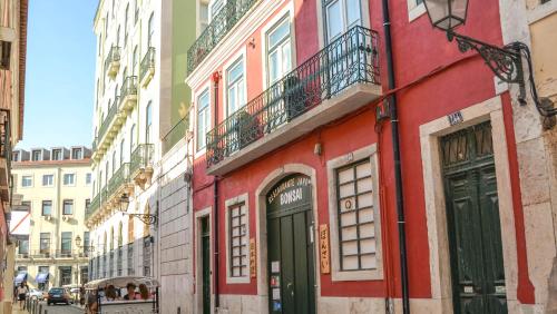 
a city street with a red brick building at Bairro Alto Suites in Lisbon
