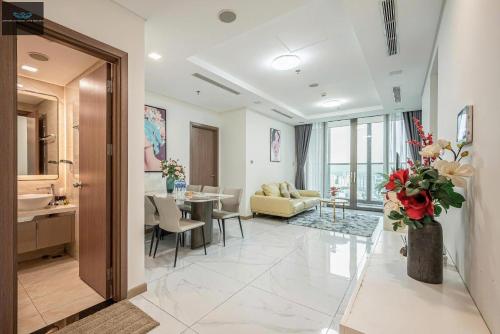 a lobby with a living room and a dining room at The Metropole Golden Horizon Residence in Ho Chi Minh City