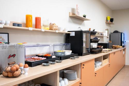 Kuchyň nebo kuchyňský kout v ubytování Nemea Appart Hotel La Boetie Bordeaux Pessac