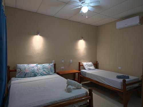 Ένα ή περισσότερα κρεβάτια σε δωμάτιο στο Ometepe House