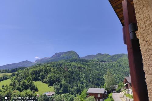 a view of the mountains from a house at Chalet des ORCHIDÉES en Chartreuse in Saint-Pierre-dʼEntremont