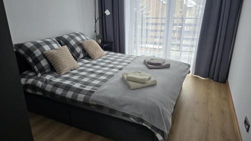 Postel nebo postele na pokoji v ubytování Apartamenty Żurawia 1- Piętro 2