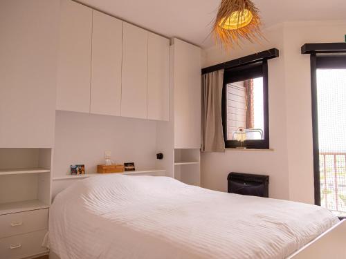 Ένα ή περισσότερα κρεβάτια σε δωμάτιο στο Nautilus - 0903