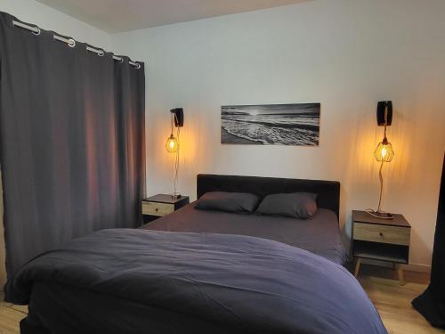 Ένα ή περισσότερα κρεβάτια σε δωμάτιο στο Lueurs des marées