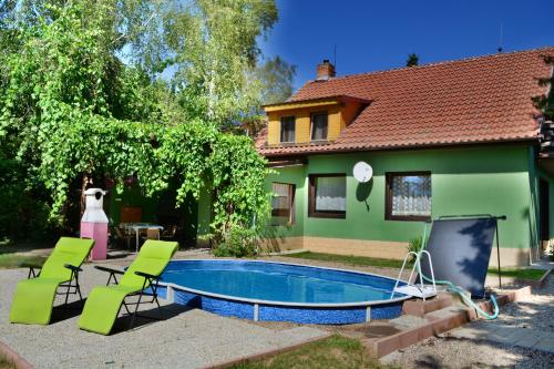 a house with a swimming pool in the yard at Areal Hradišek in Klobouky u Brna