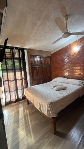 a bedroom with a large bed in a room at Loft guelaguetza A in Santa Cruz Huatulco