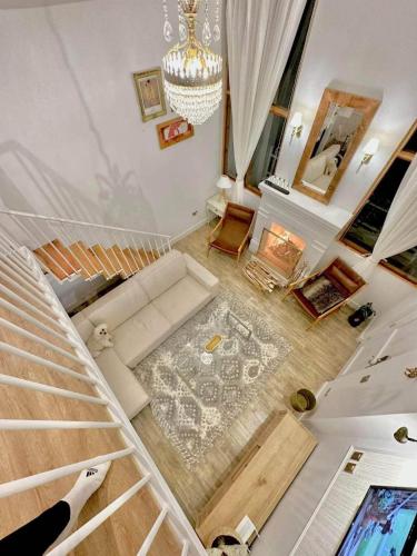 an overhead view of a living room with a staircase at HOLLY HOUSE Casa privada completa in Chachapoyas