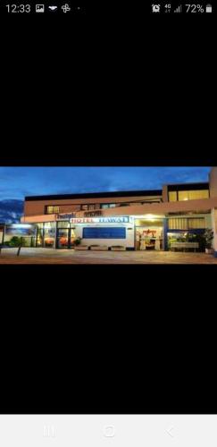 a picture of a building with a train in it at Hotel Hawai in Villa Carlos Paz