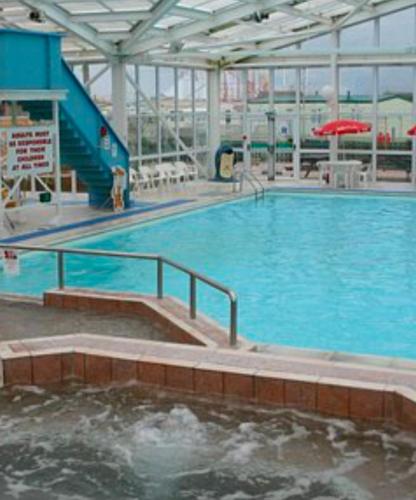 a large pool of water in a large building at Sam's Caravan Hire in Ingoldmells