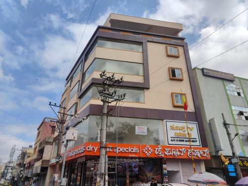 a tall building on a street in a city at Suites19 in Bengaluru