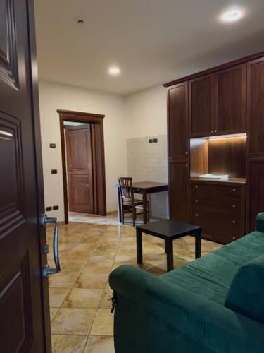 a living room with a couch and a table at Hotel Valle del Subasio in Capitan Loreto