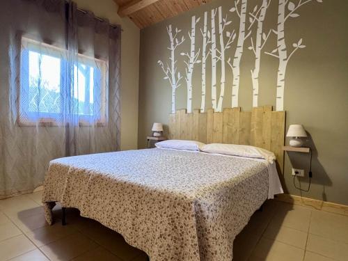 Ένα ή περισσότερα κρεβάτια σε δωμάτιο στο Agriturismo Il Timo