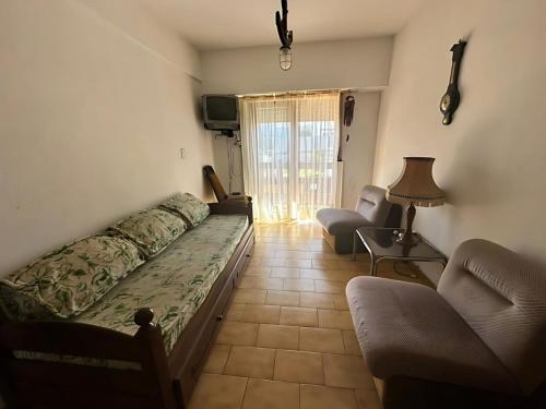 Giường trong phòng chung tại Amplio Departamento en Pleno Corazón de Mar de Ajo 2 Dormitorios a una cuadra de la Playa y a 2 de la Peatonal