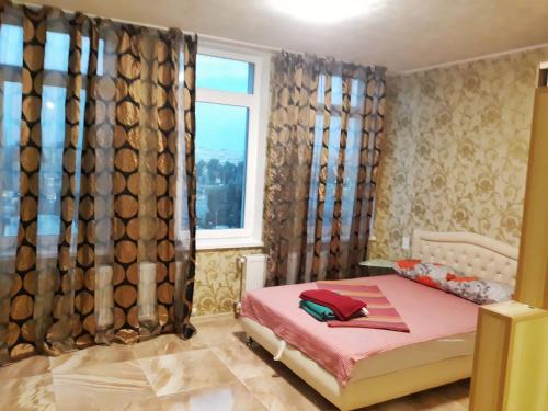 Ένα ή περισσότερα κρεβάτια σε δωμάτιο στο Студия в ЖК Воронцовский, рядом McDonald's