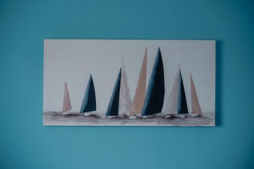 a picture of a group of sailboats in the water at Sarina's apartment in Palermo