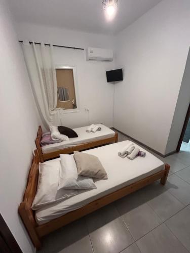 Postel nebo postele na pokoji v ubytování Lemonia