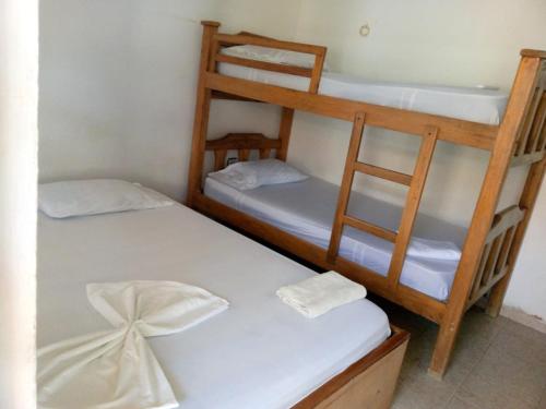 Postel nebo postele na pokoji v ubytování Confort Mary plazas