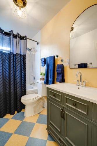 a bathroom with a sink and a toilet and a mirror at Cap Hill Row 2 Bedrooms, Walk to Sights, Parking in Washington, D.C.