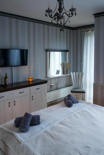 Ένα ή περισσότερα κρεβάτια σε δωμάτιο στο Pirin Elegance Apartment by Gondola Lift