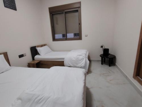 Ένα ή περισσότερα κρεβάτια σε δωμάτιο στο Brand new apartment in Sport city Tangier