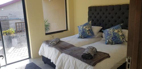 Postel nebo postele na pokoji v ubytování 4Th On Boundary